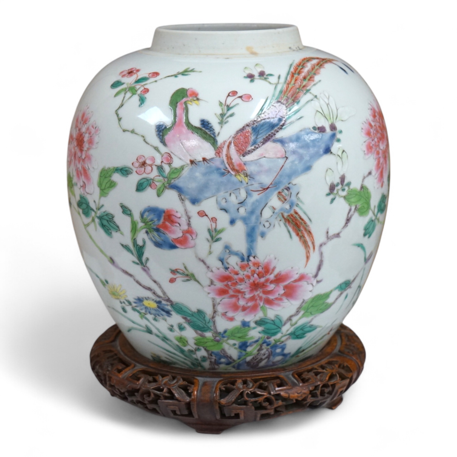 A late 19th century Chinese famille rose 'pheasant' jar lacking cover, with finely carved wooden stand, 21.5cm high including stand.